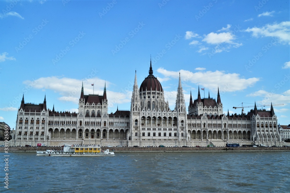 parliament of budapest on the danube blue sky