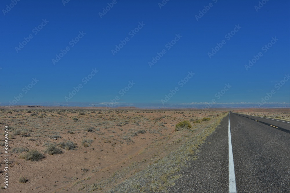 road into the distance in the desert in the usa road into the distance in the desert in the usa