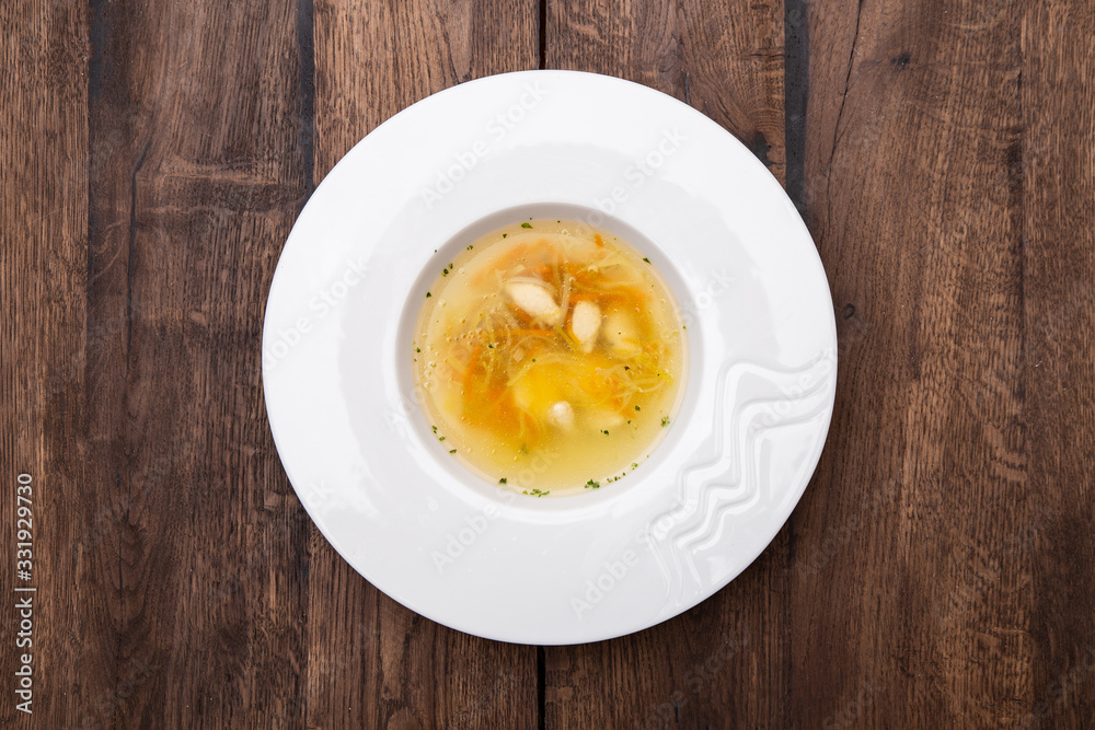Chicken consomme with dumplings .
Chicken broth with chicken fillet dumplings and quail egg. Healthy dietary tasty food, homemade meals. A plate of Chicken broth. Top view. Chicken consomme with dumplings .
Chicken broth with chicken fillet dumplings and quail egg. Healthy dietary tasty food, homemade meals. A plate of Chicken broth. Top view.