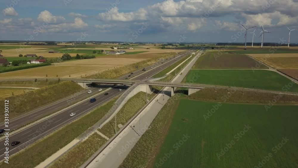 Aerial view of Highway A8 and wind turbines in corn fields on the swabian alp between Ulm and Merklingen with construction works of the Stuttgart21 railway project Aerial view of Highway A8 and wind turbines in corn fields on the swabian alp between Ulm and Merklingen with construction works of the Stuttgart21 railway project