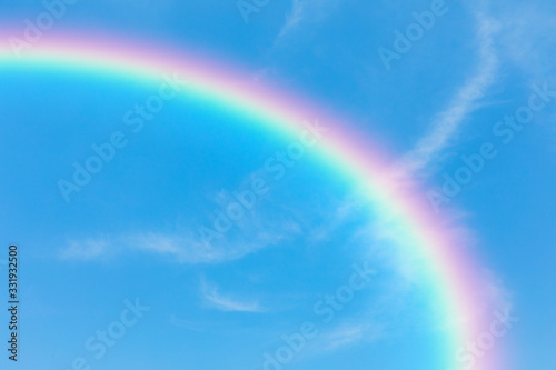 Blue sky and clouds and rainbow background © pushish images