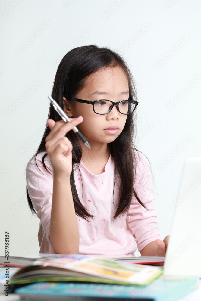 Portrait of attractive young asian girl using laptop isolated on white background Portrait of attractive young asian girl using laptop isolated on white background