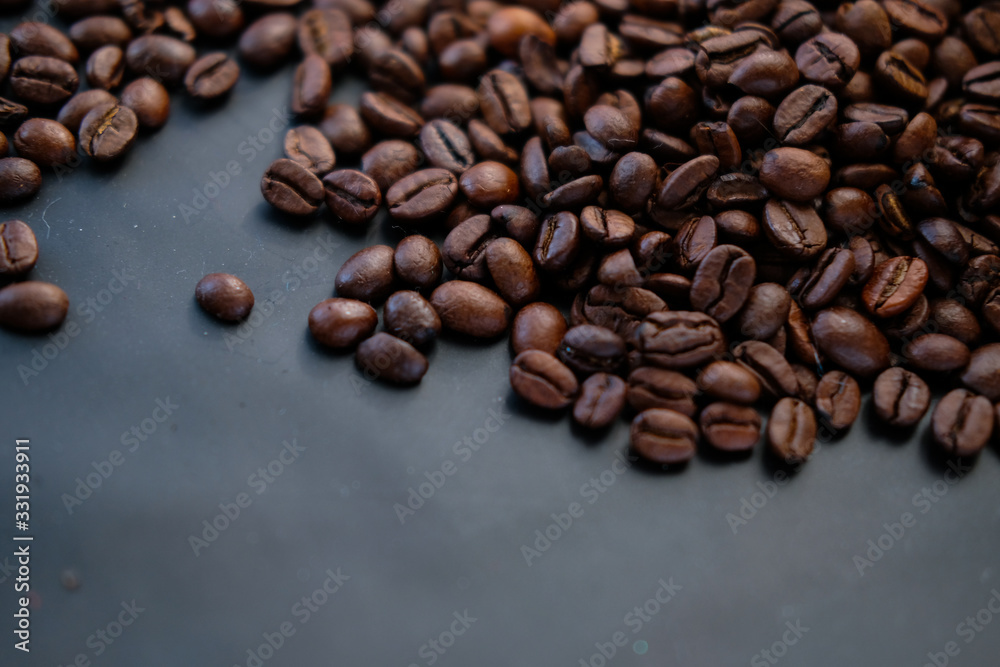 coffee beans are on a black background.