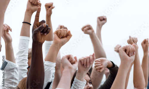 cropped image of a youth group pointing up.