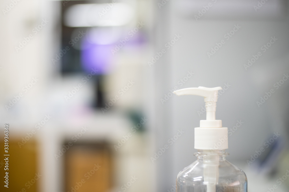 alcohol gel on blur background with protected coronavirus. alcohol gel on blur background with protected coronavirus.