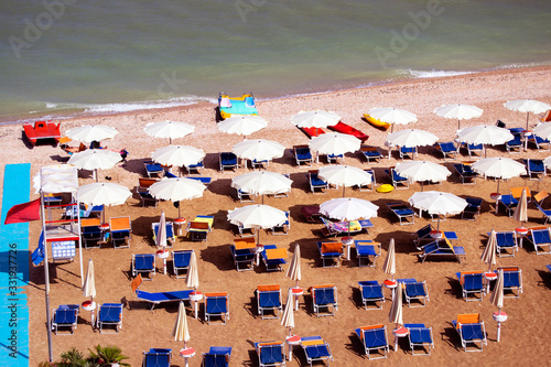 aerial view of parasols and beachline in Marotta. For travel and holiday concepts © giodilo