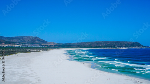 Blue ocean and white sand of South Africa beach tropical beach vacation scene