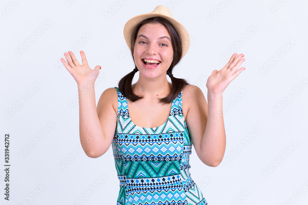 Portrait of happy young beautiful tourist woman looking excited and surprised Portrait of happy young beautiful tourist woman looking excited and surprised