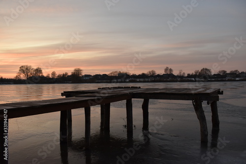 Fototapeta Naklejka Na Ścianę i Meble -  old wooden pier at sunset