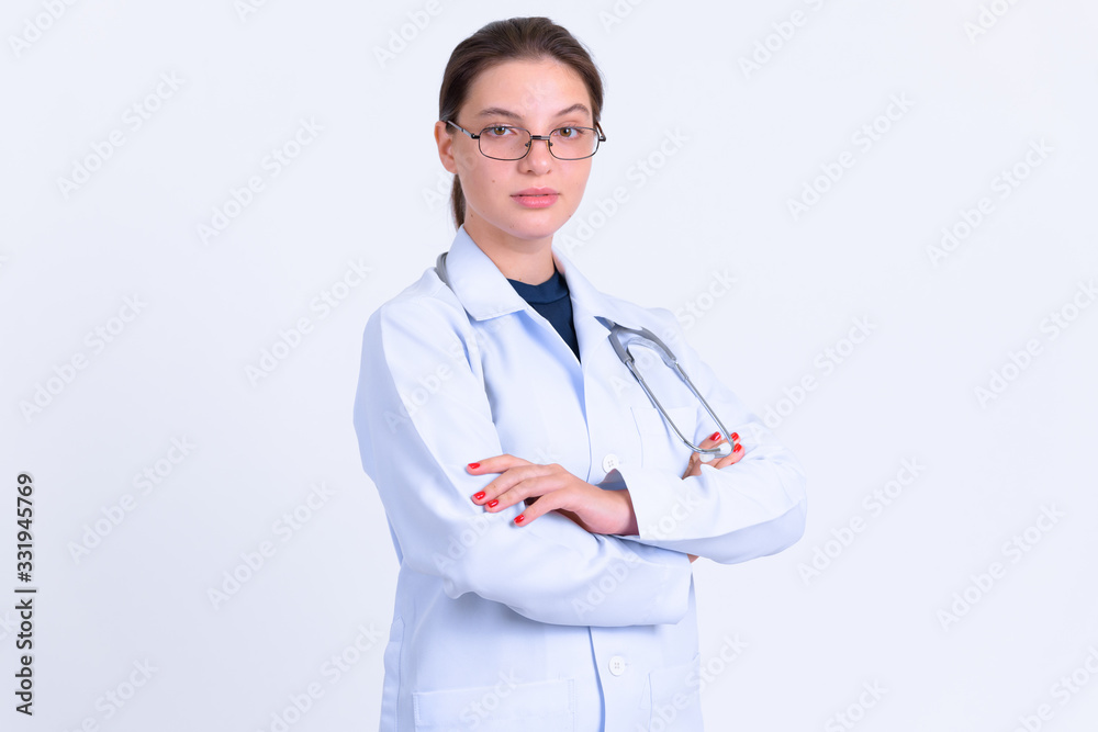 Portrait of young beautiful woman doctor with arms crossed Portrait of young beautiful woman doctor with arms crossed