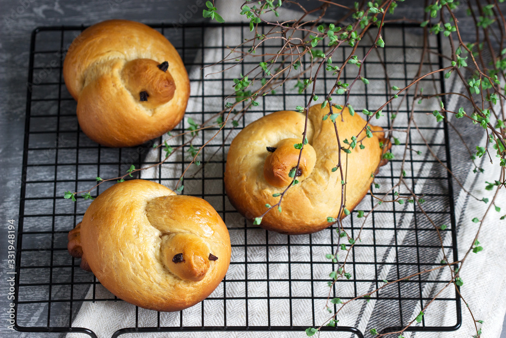 Traditional spring bird-shaped lean buns coated with sweet syrup.