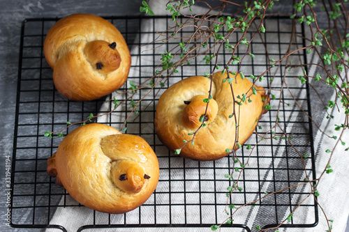 Traditional spring bird-shaped lean buns coated with sweet syrup.