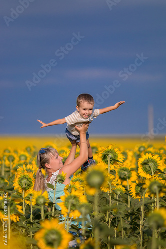 Mom and son in sunflowers 