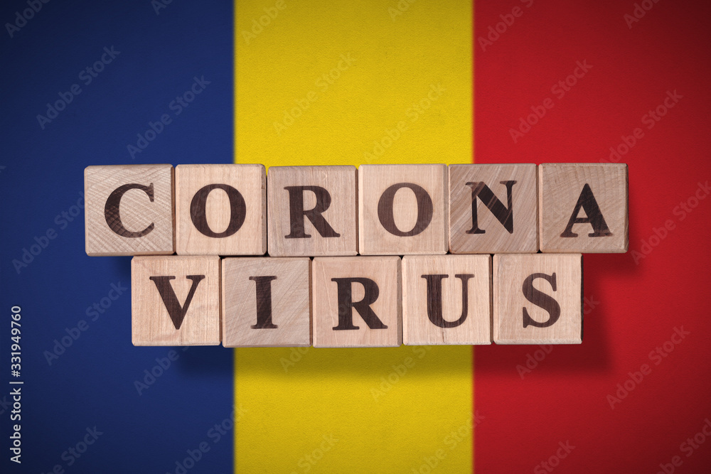 Flag of Romania with wooden cubes spelling coronavirus on it. 2019 - 2020 Novel Coronavirus (2019-nCoV) concept, for an outbreak occurs in Romania. Flag of Romania with wooden cubes spelling coronavirus on it. 2019 - 2020 Novel Coronavirus (2019-nCoV) concept, for an outbreak occurs in Romania.