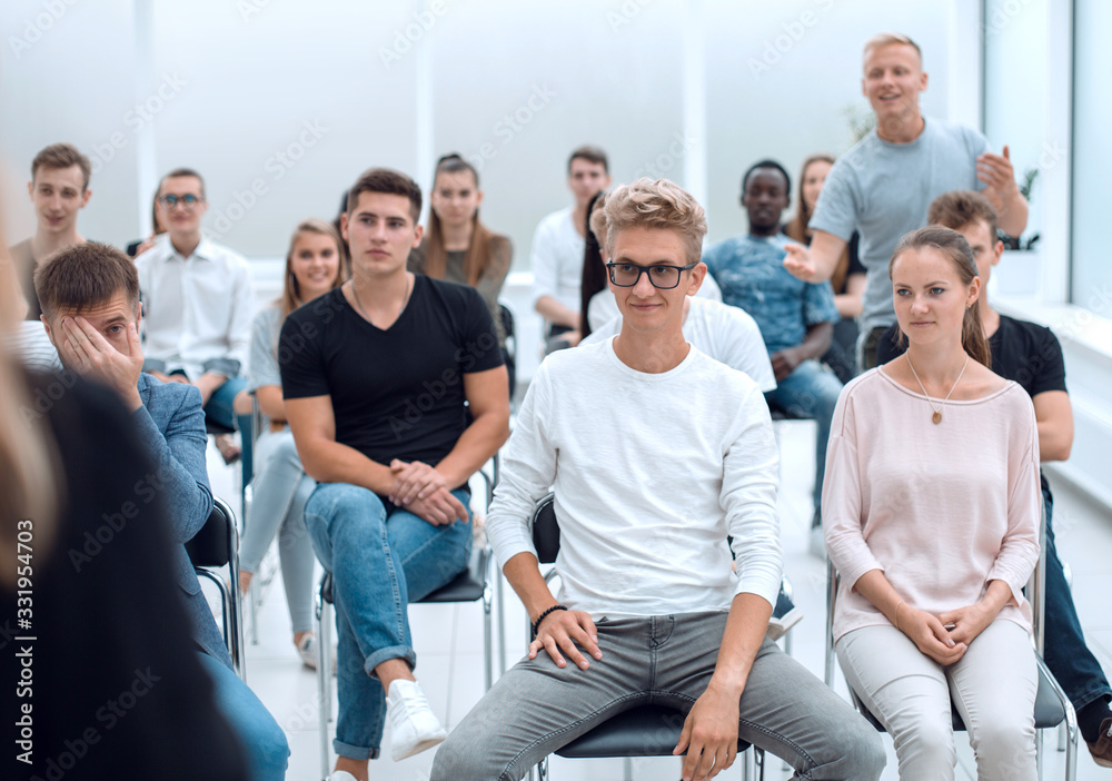 diverse seminar listeners sitting in the conference room.