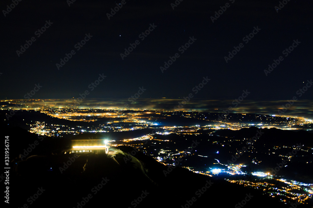 Plain illuminated partially covered by fog, soft lights Plain illuminated partially covered by fog, soft lights