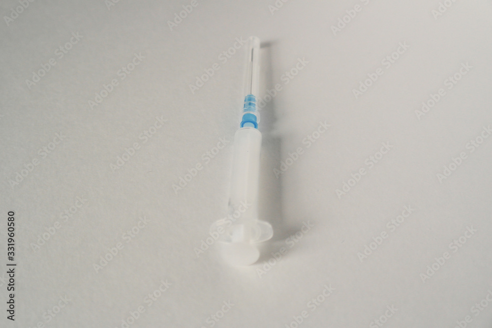 Syringe on a white background, disease, treatment Syringe on a white background, disease, treatment