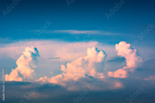 Sunset with pink fluffy clouds in a sky © Bashkatov