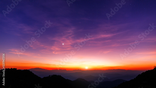 Majestic sunset sky over the mountains landscape