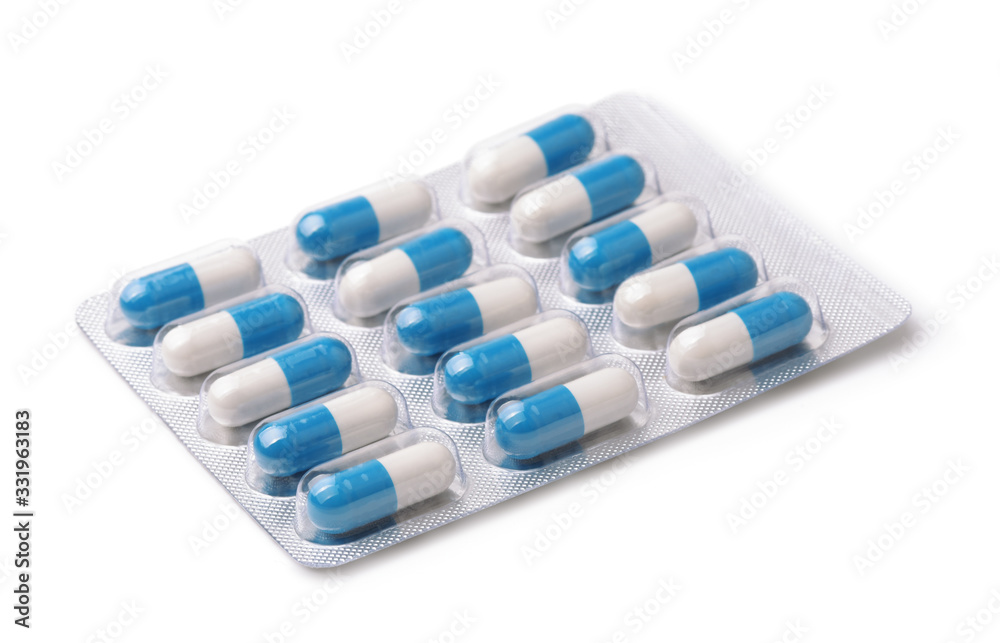 White and blue capsules in blister pack