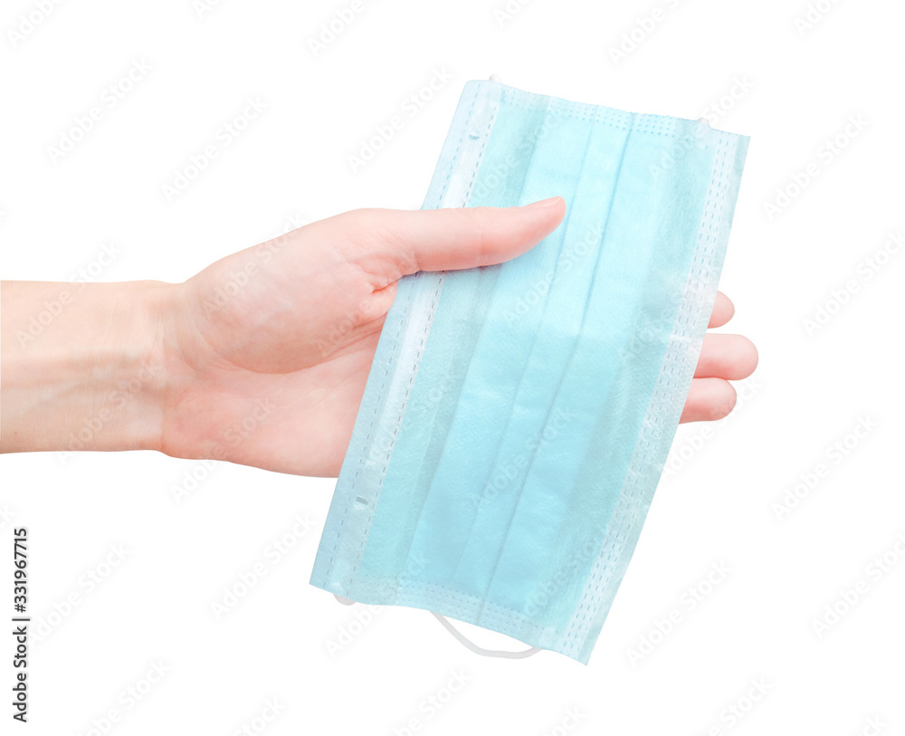 Medical mask in human hand. Isolated design on white background. Respiratory protection of virus
