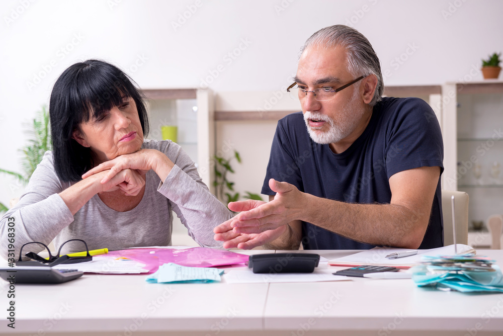 Senior couple discussing financial plans Senior couple discussing financial plans