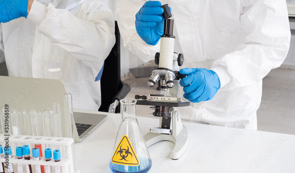 Scientists in the aseptic laboratory are looking for new species of virus to analyze and find ways to kill the virus. In the concept of research in the laboratory Scientists in the aseptic laboratory are looking for new species of virus to analyze and find ways to kill the virus. In the concept of research in the laboratory