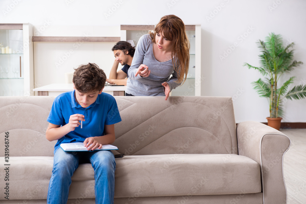 Concept of underage smoking with young boy and family