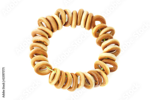 Small bagels or baranki  isolated on white background. Bunch of sushki dry bread rolls.. photo