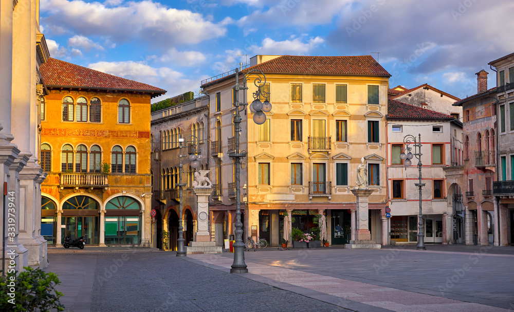 Bassano del grappa Italy. Square freedom. Landscape old town with italian architecture and street lamp. Sunrise at deserted street.