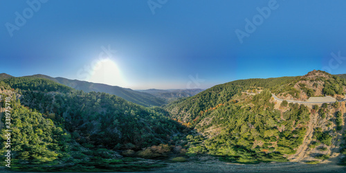 360 degree spherical panorama landscape of Cyprus mountains. Mountain road and colorful forest