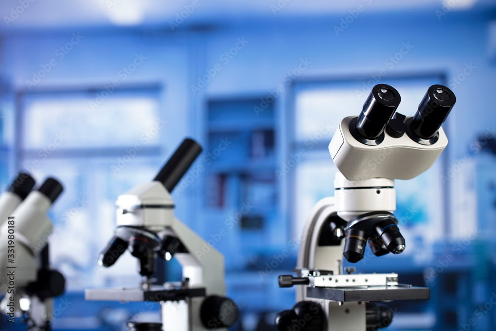 Modern scientific laboratory interior. Reaserch station with microscopes on the glass table. Modern scientific laboratory interior. Reaserch station with microscopes on the glass table.