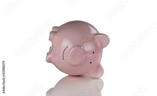 Tipped over piggy bank for financial crisis concept