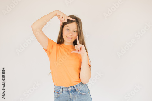 girl making a gesture for the camera © Danko