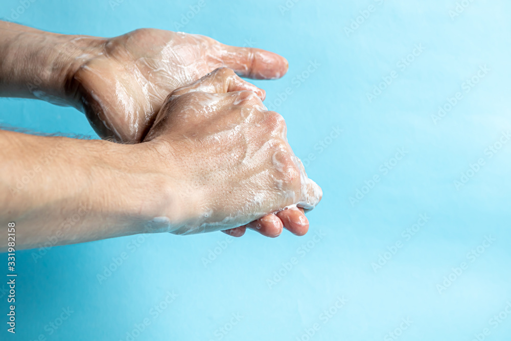 A man washes his hands with soap and uses an antiseptic to clean and disinfect his hands. Virus Prevention, Coronovirus. Hygiene concept hand detail. A man washes his hands with soap and uses an antiseptic to clean and disinfect his hands. Virus Prevention, Coronovirus. Hygiene concept hand detail.