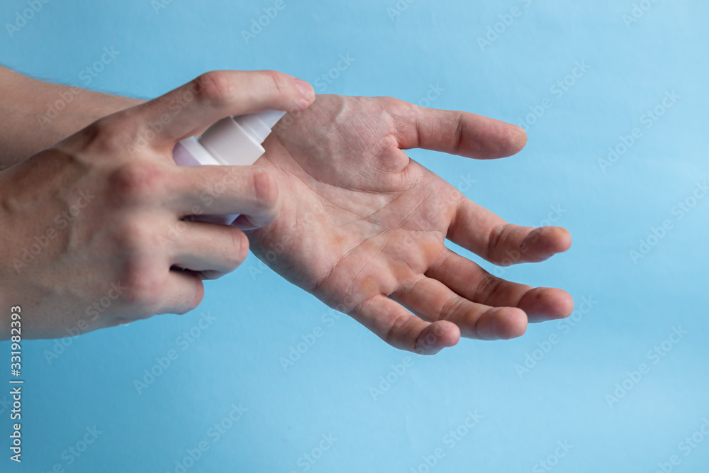 Fototapeta premium A man washes his hands with soap and uses an antiseptic to clean and disinfect his hands. Virus Prevention, Coronovirus. Hygiene concept hand detail.