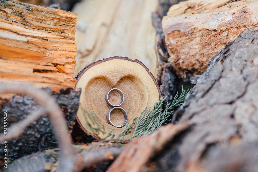 Wedding Ring symbol of love and human relationships on wood bowl
