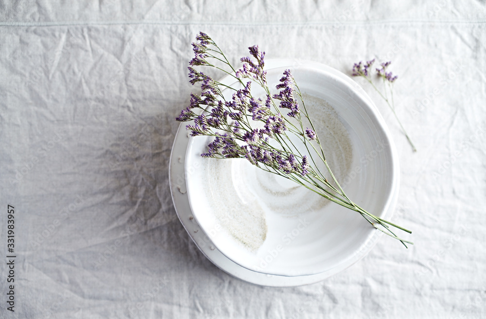 Dried purple flowers on a ceramic bowl. Copy space. Flat lay Dried purple flowers on a ceramic bowl. Copy space. Flat lay