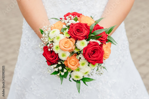 bride holds a beautiful wedding bouquet