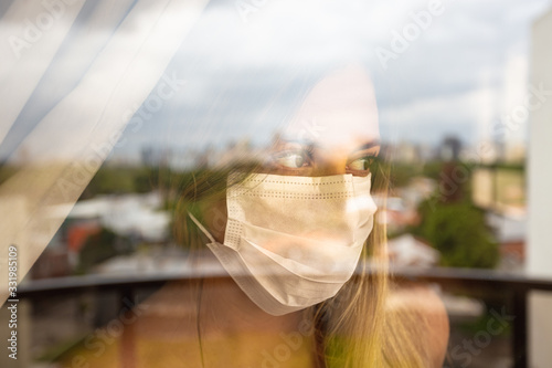 Quarantine girl in her apartment due to the cororavirus epidemic photo