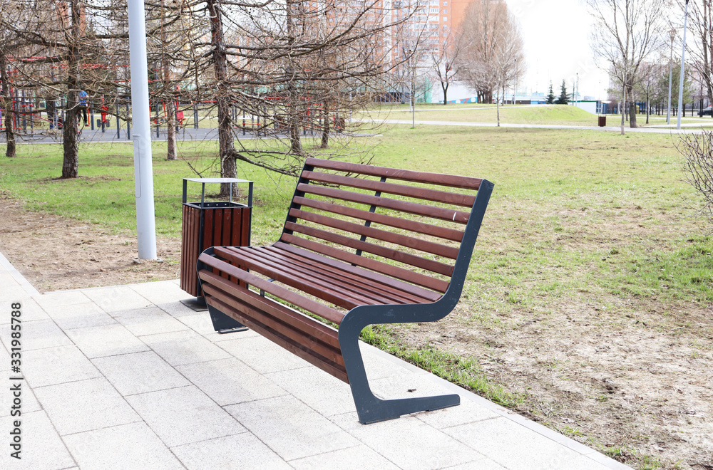 park benches in spring in a big city park benches in spring in a big city