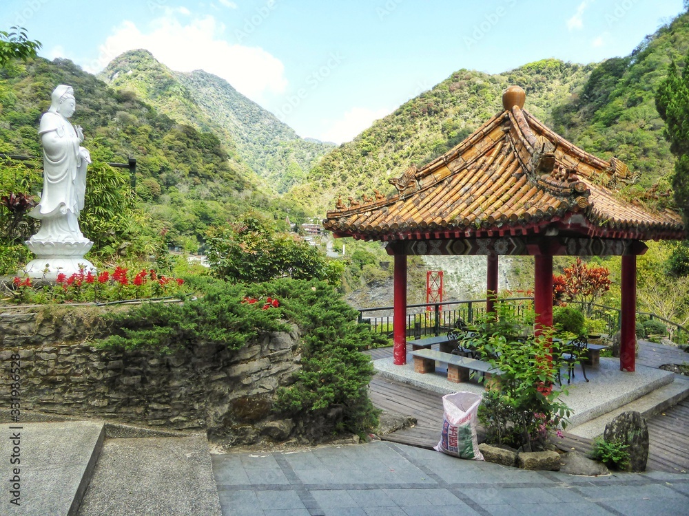 Peaceful Buddhist tranquil park, pavilion and mountains in background Peaceful Buddhist tranquil park, pavilion and mountains in background