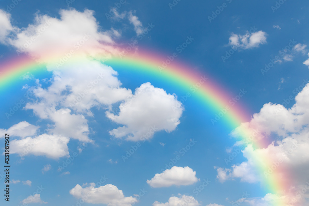 Blue sky and clouds with rainbows background.