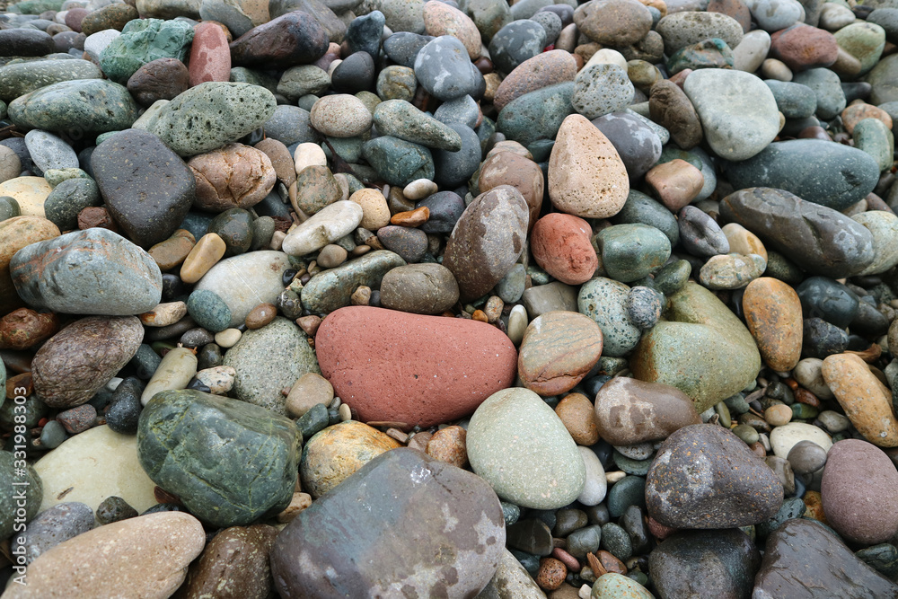 Pebble stones on the beach for background or banner Pebble stones on the beach for background or banner