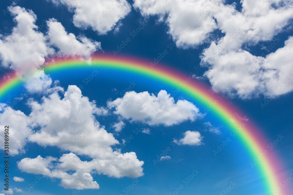 Blue sky and clouds with rainbow
