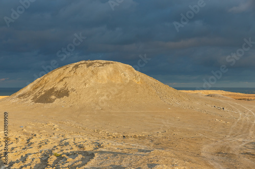 Mud volcanoes of Gobustan near Baku  Azerbaijan. mud mountain and stormy sky