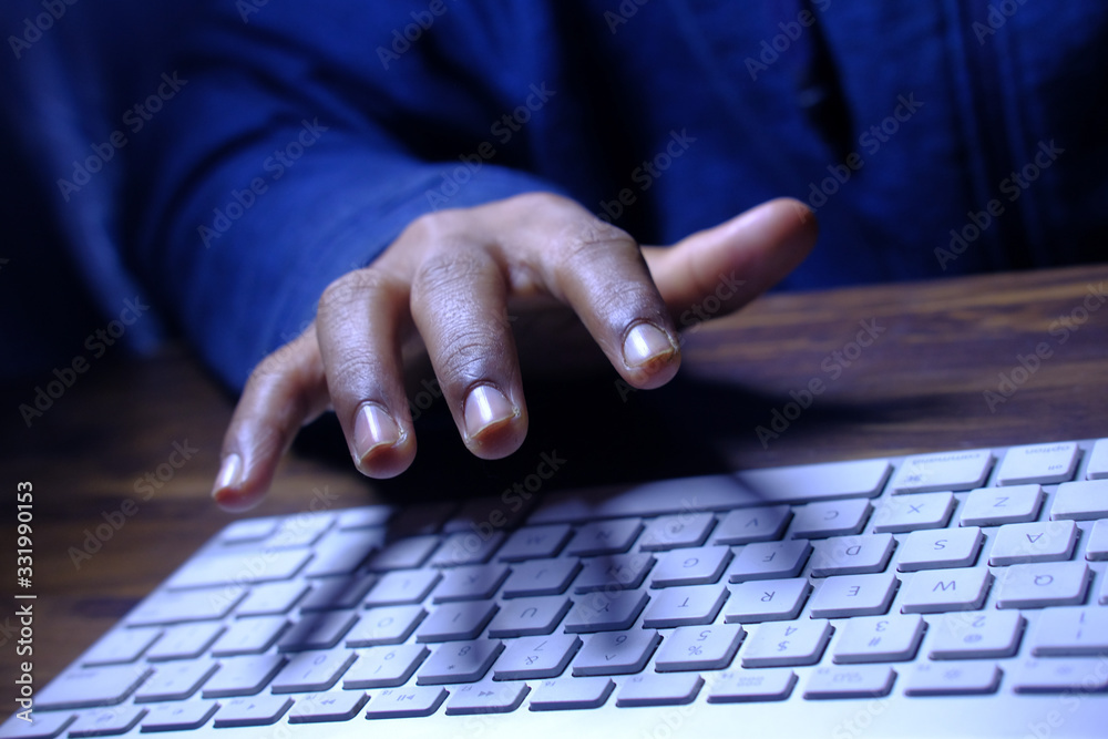 Close up of hacker hand stealing data 