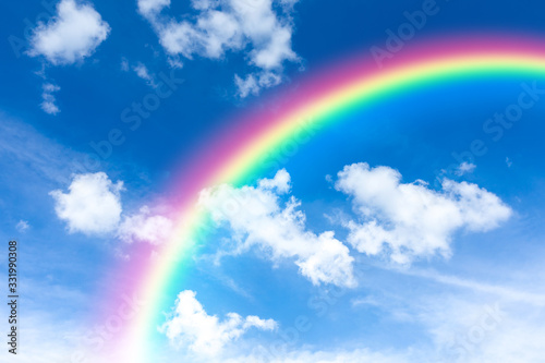 Blue sky and clouds with rainbow background