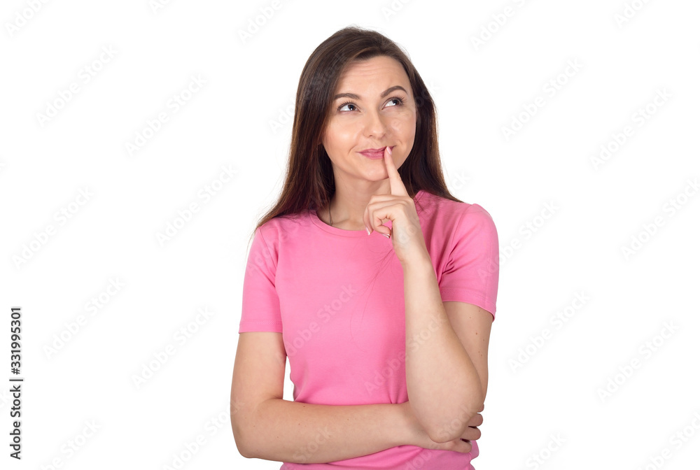 Young brunette woman in a pink sweater is thinking about something important, isolated on a white background and looking at the camera. Young brunette woman in a pink sweater is thinking about something important, isolated on a white background and looking at the camera.
