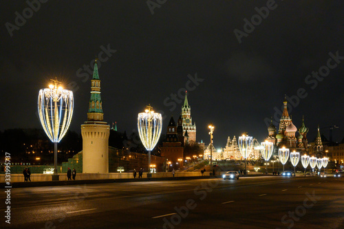 View of the Kremlin, Vasilyevsky Spusk Square, St. Basil's Cathedral and the Great Moskvoretsky Bridge with New Year and Christmas decorations, Moscow, Russian Federation, January 10, 2020 photo